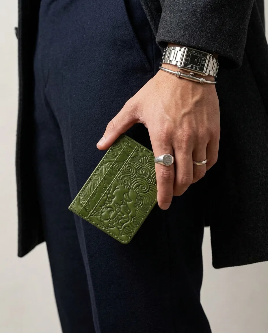 Matcha shishi embossed card holder, held in hand