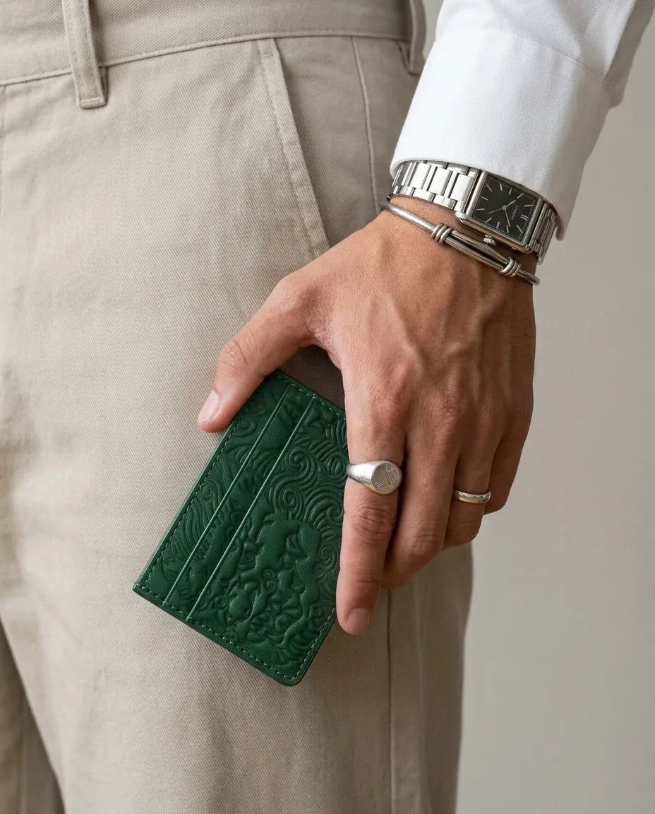 Pine Green shishi embossed card holder, held in hand