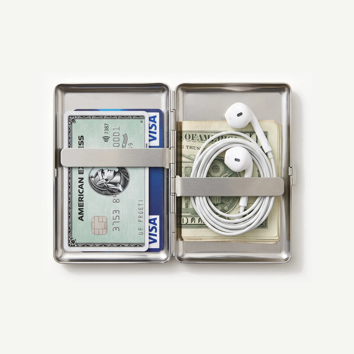 Tin case open with cards and wired earphones