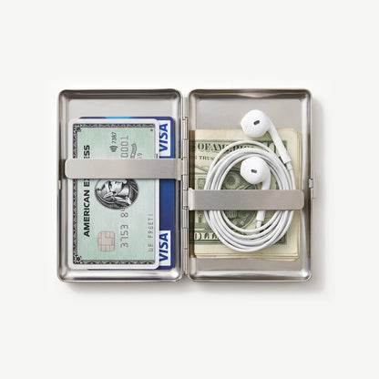 Tin case open with cards and wired earphones
