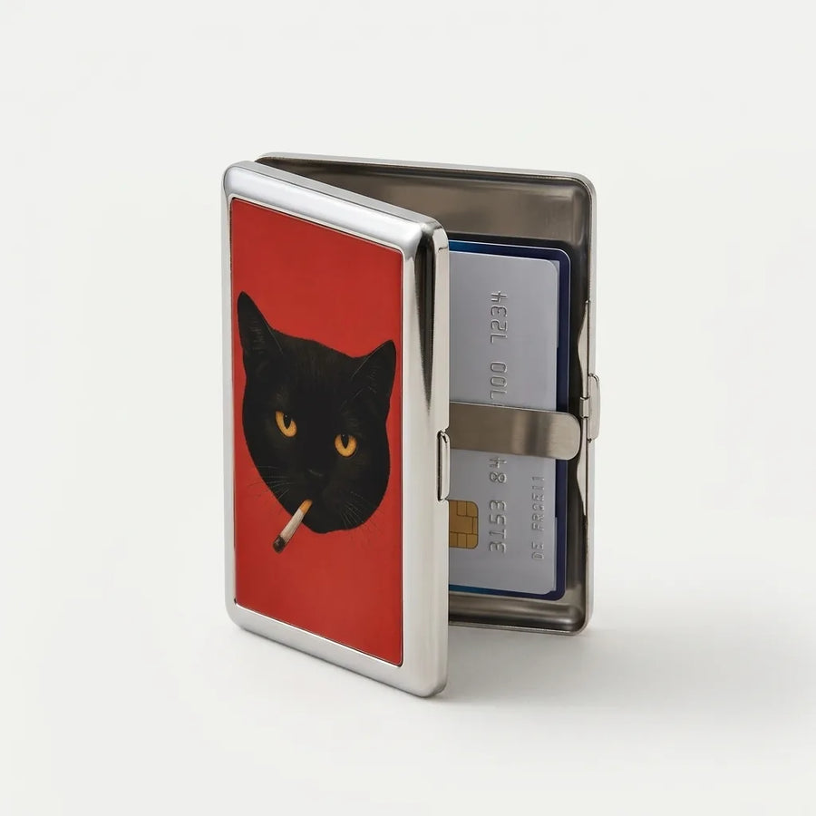 Alley Tom tin card case half open, cards held by metal bands inside